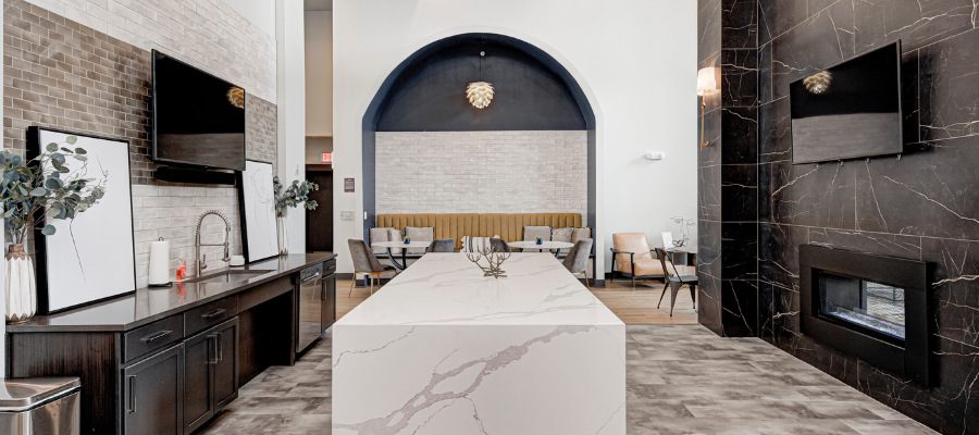 The Verge Apartments' exterior with a large patio area